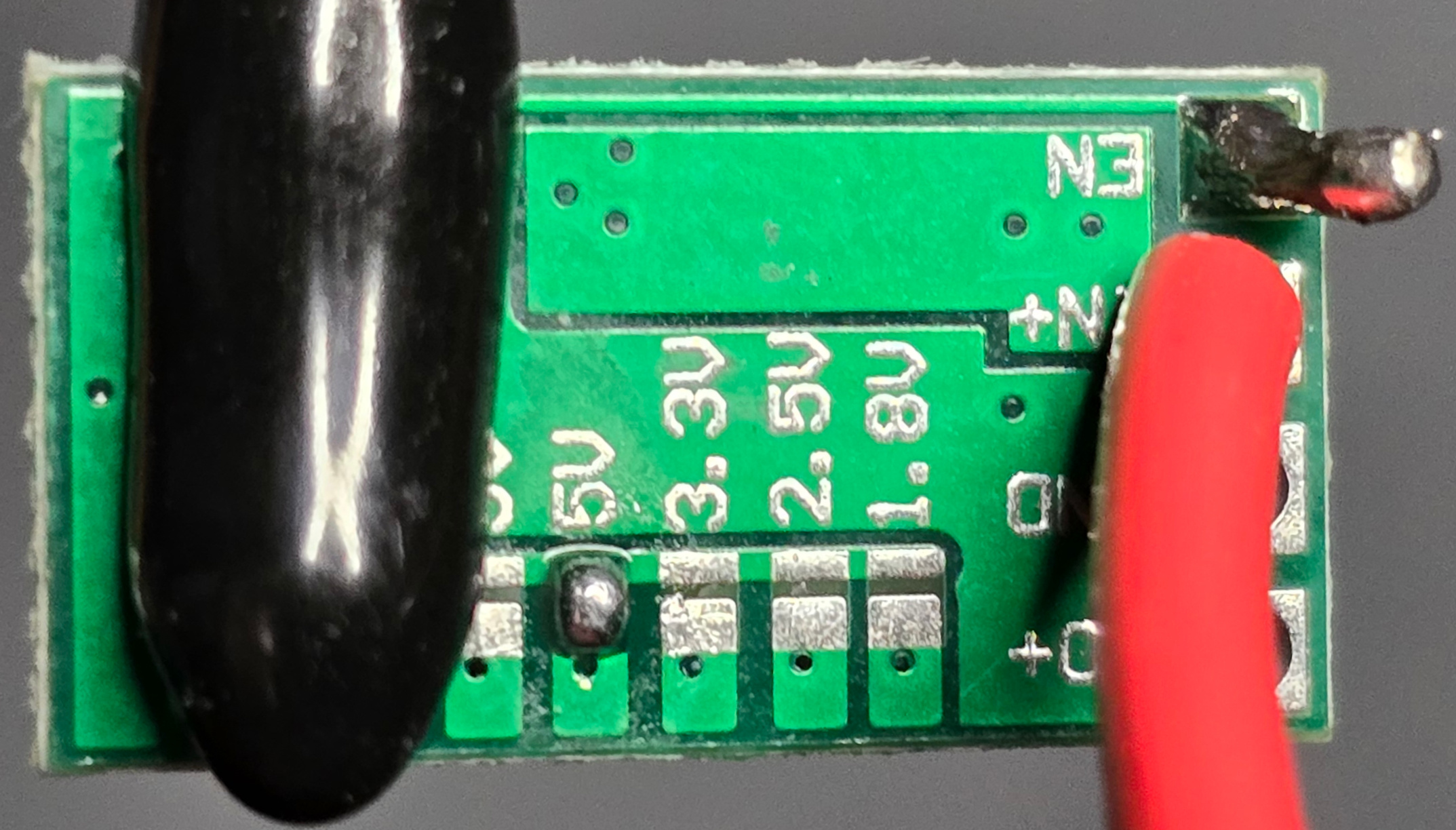 Bottom view of soldered positive wire